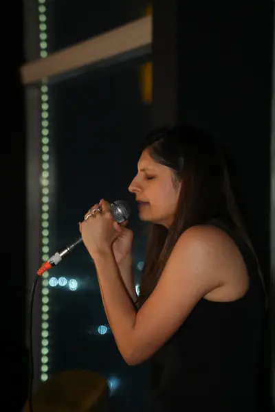 Vocalist under the stage lights
